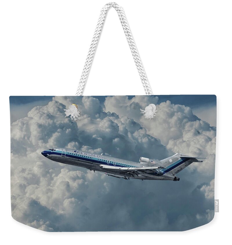 Eastern Airlines Weekender Tote Bag featuring the photograph Eastern Airlines 727 with Billowing Clouds by Erik Simonsen