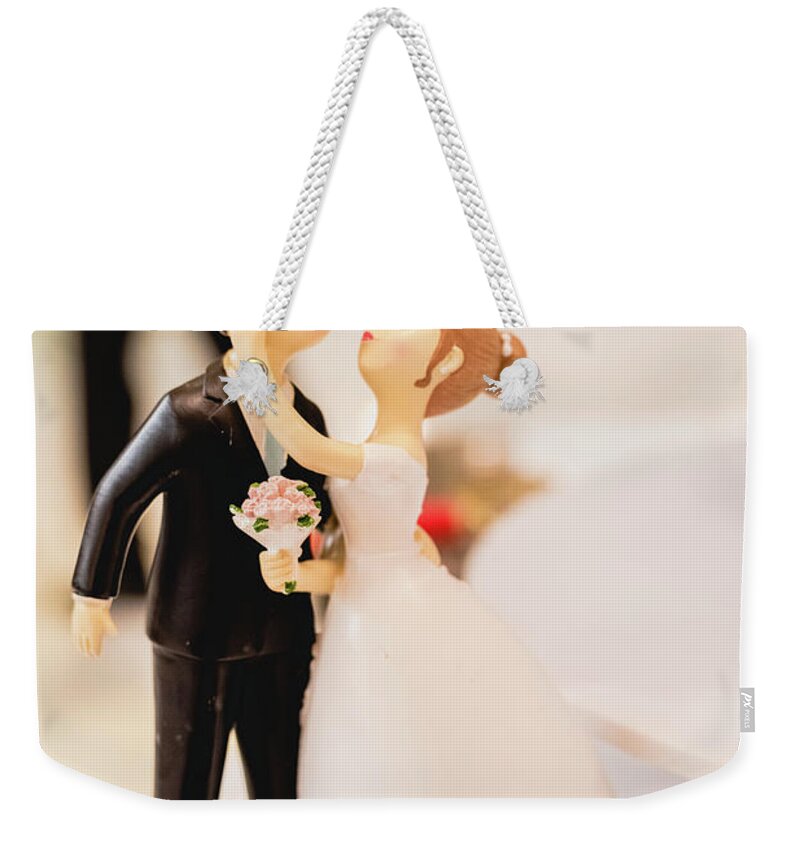 Background Weekender Tote Bag featuring the photograph Elegant wedding cake dolls by Joaquin Corbalan
