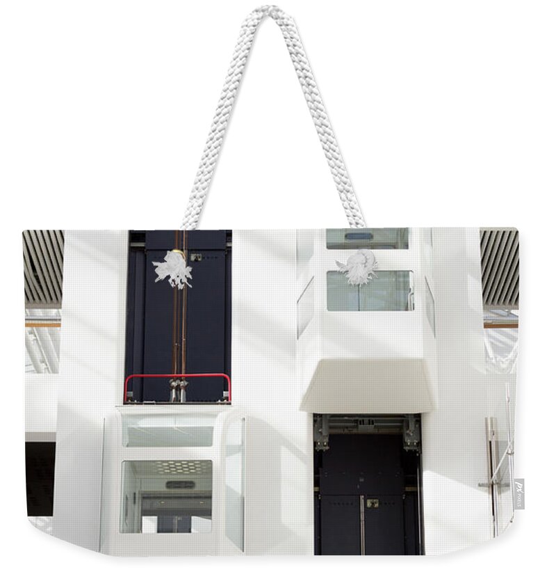 Steps Weekender Tote Bag featuring the photograph Elevator Inside A Office by Blurra