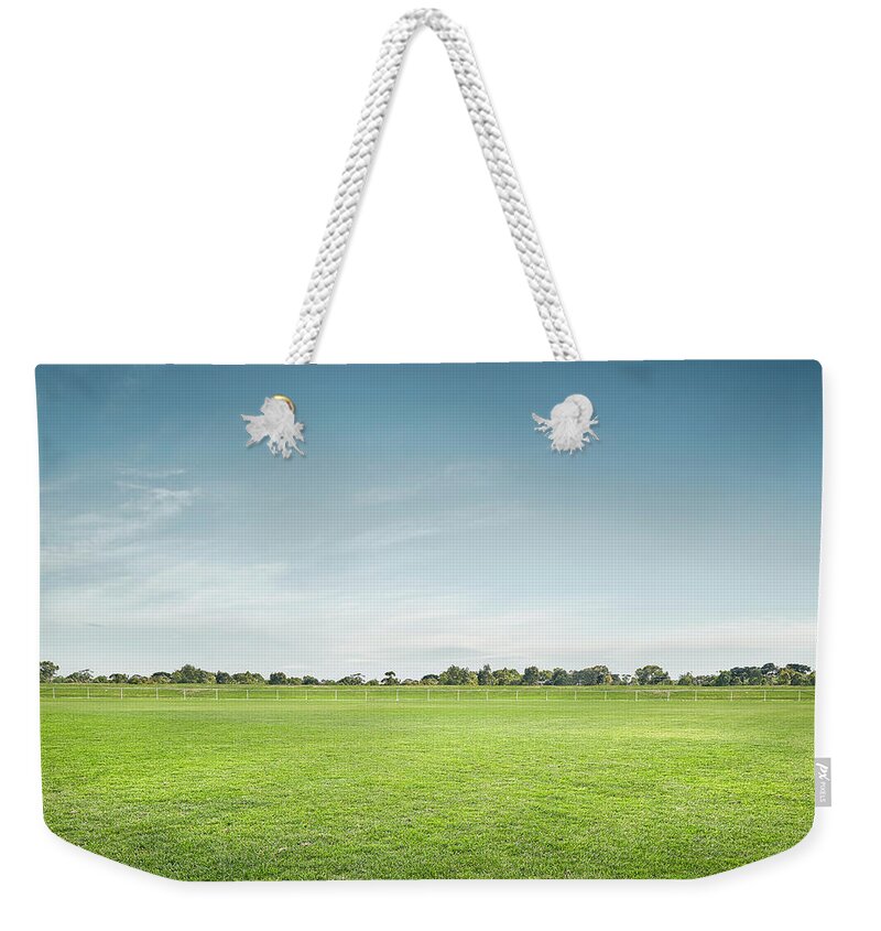 Tranquility Weekender Tote Bag featuring the photograph Empty Sports Ground by Aaron Foster