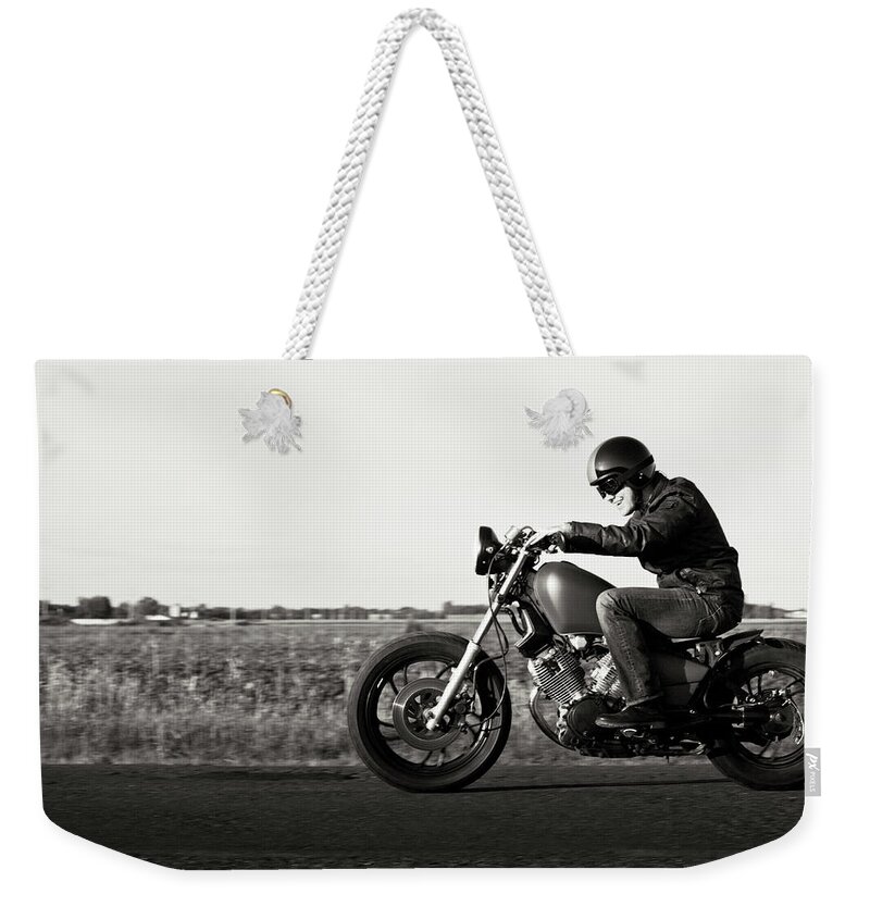 Crash Helmet Weekender Tote Bag featuring the photograph Enjoying A Motorcycle Ride In The Sunset by Vtwinpixel