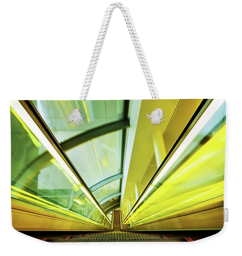 Steps Weekender Tote Bag featuring the photograph Escalator Moving Down by Nikada