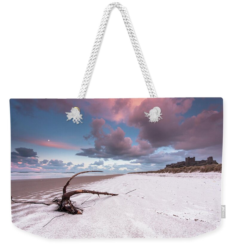 Landscape Weekender Tote Bag featuring the photograph Fairy Tale Castle with snow on the beach by Anita Nicholson