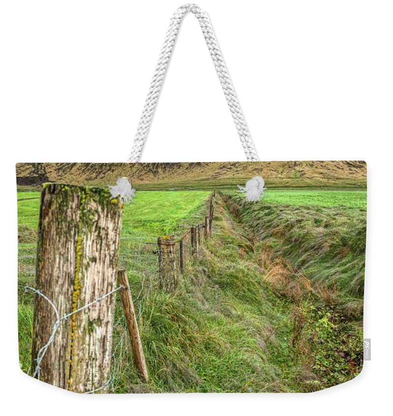 Iceland Weekender Tote Bag featuring the photograph Fence of Iceland by David Letts