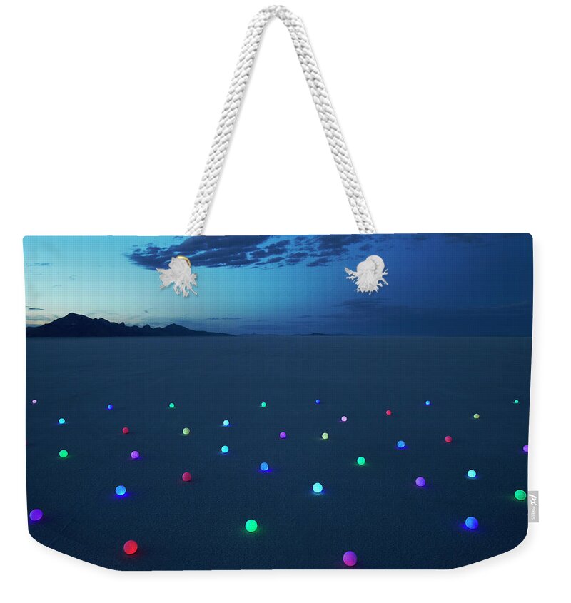 Scenics Weekender Tote Bag featuring the photograph Field Of Glowing Orbs In Desert At Dusk by Andy Ryan