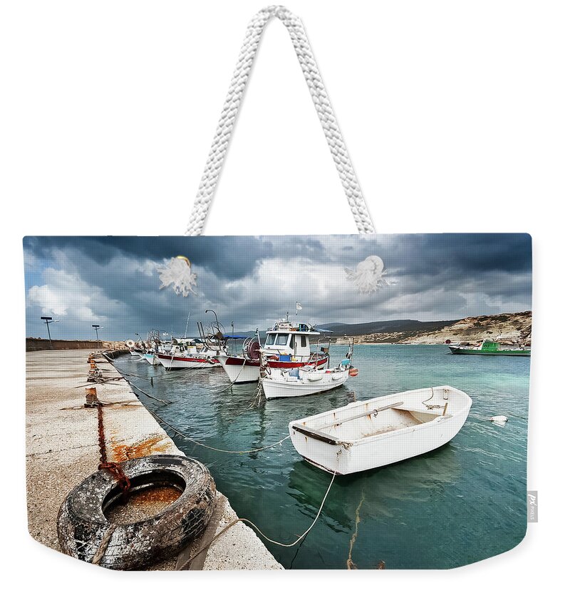 Seascape Weekender Tote Bag featuring the photograph Fishing Boats Along The Harbour Wall by Lee Stevens