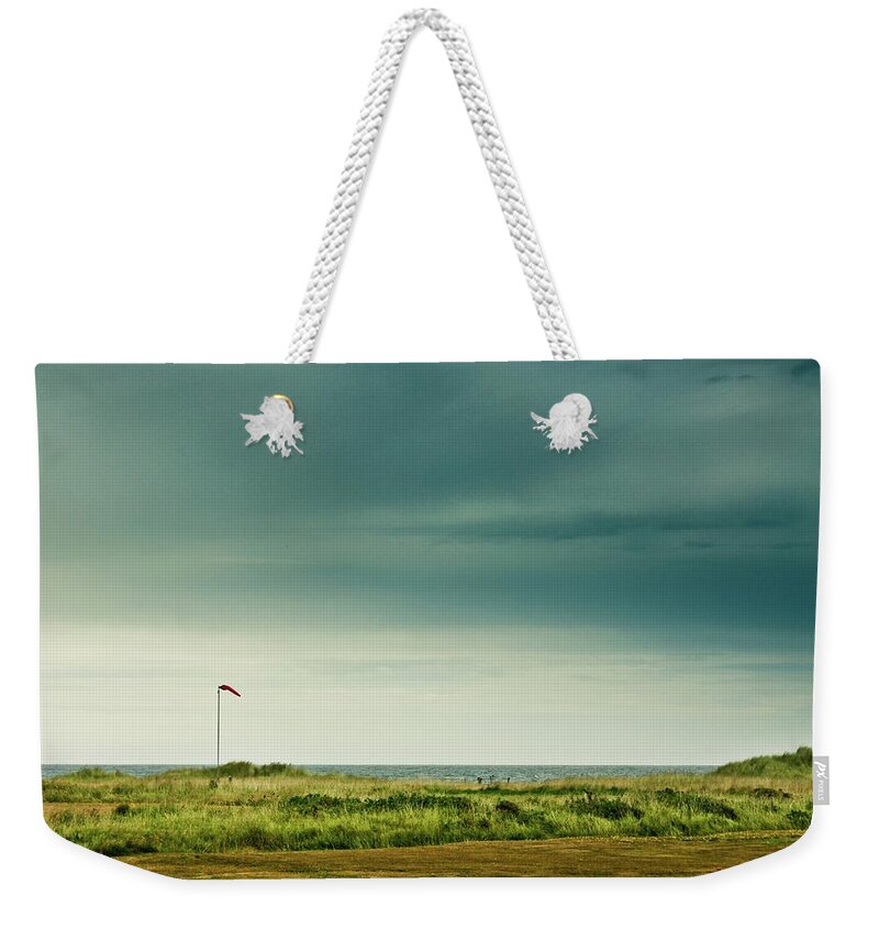 Tranquility Weekender Tote Bag featuring the photograph Flag At Wairarapa Coast by New Zealand Transition