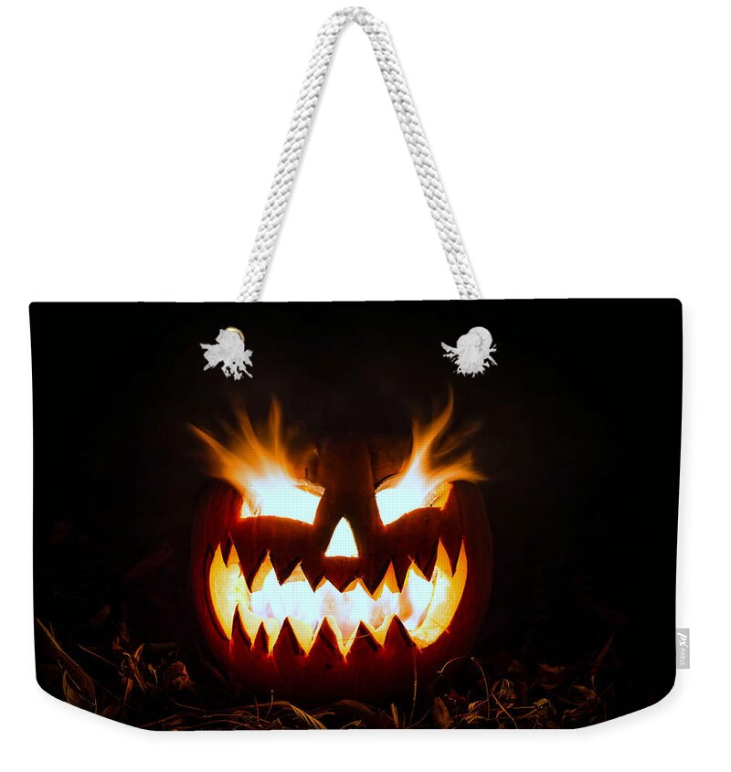 Halloween Weekender Tote Bag featuring the photograph Flaming Pumpkin by Mike Ronnebeck