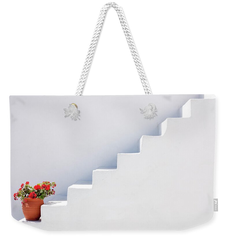 Tranquility Weekender Tote Bag featuring the photograph Flowerpot On Steps, Oia, Santorini by David Clapp