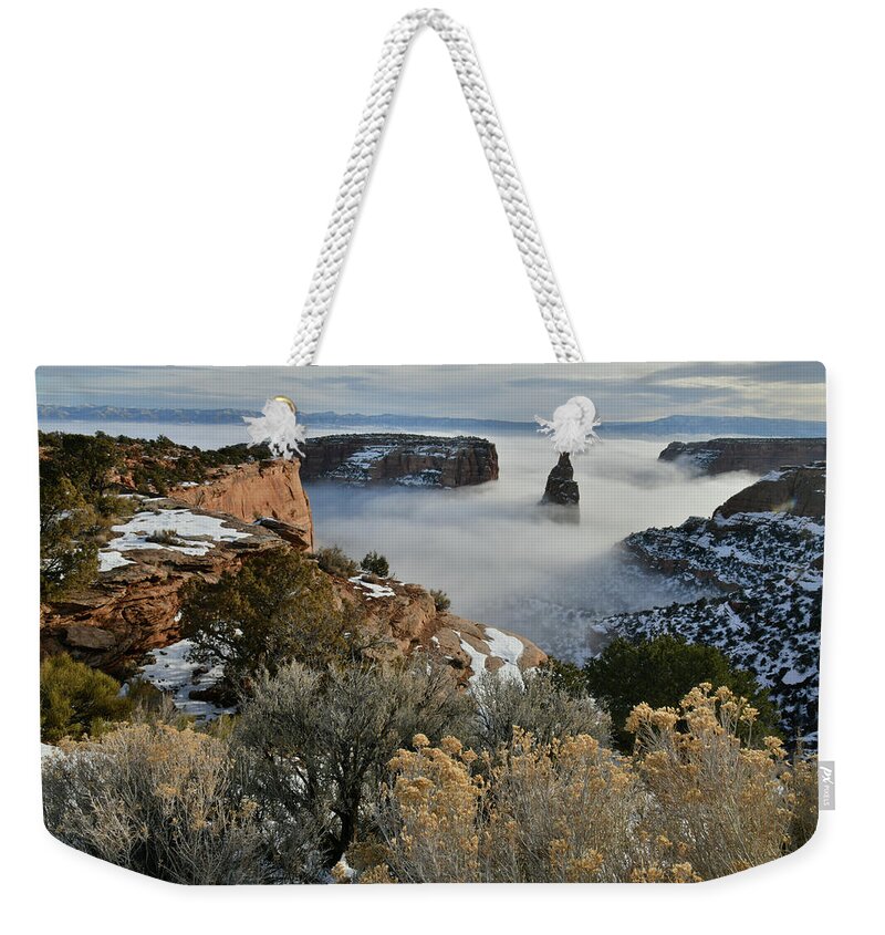Colorado National Monument Weekender Tote Bag featuring the photograph Fog Smothers Independence Monument by Ray Mathis