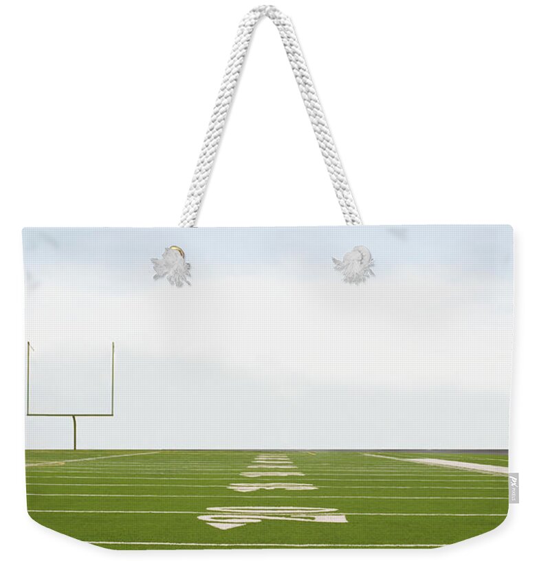 Viewpoint Weekender Tote Bag featuring the photograph Football Field by Tetra Images - David Engelhardt