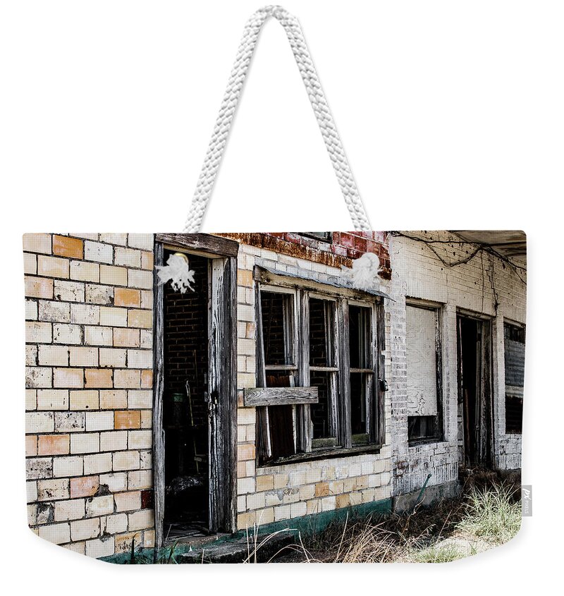 Photo Weekender Tote Bag featuring the photograph Forgotten store by Jason Hughes