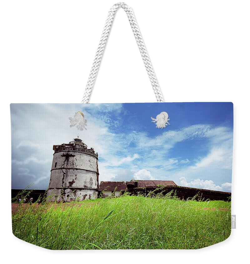 Grass Weekender Tote Bag featuring the photograph Fort Aguada Lighthouse, Goa by Sushil Kumar