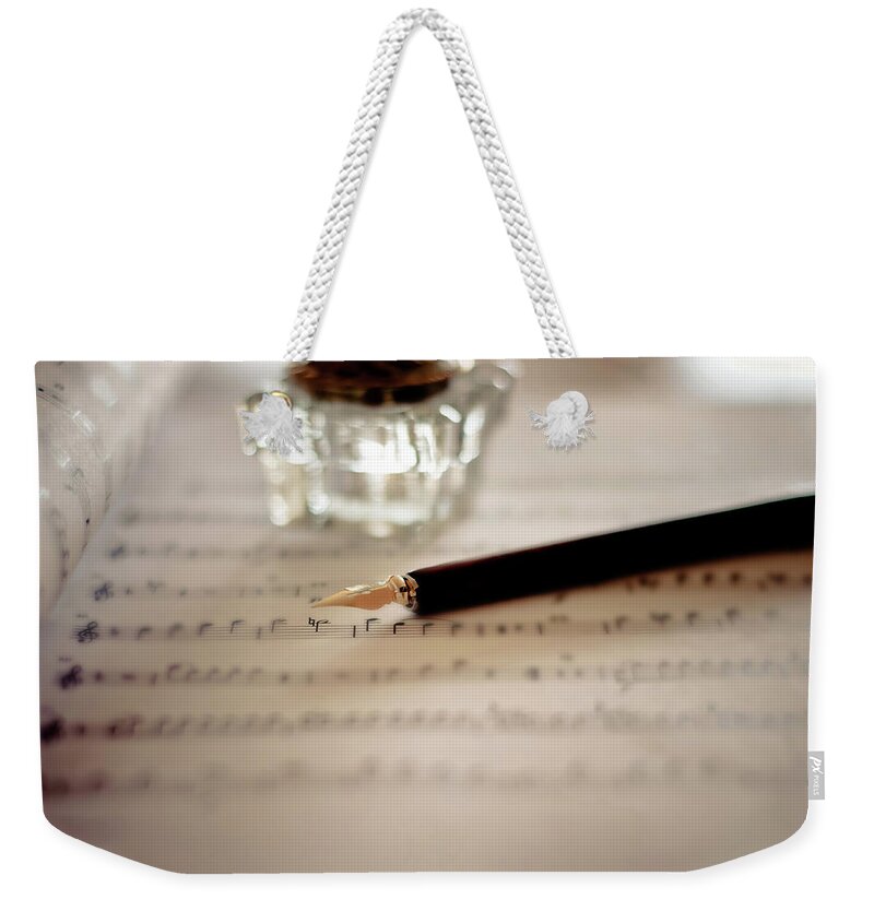 Sheet Music Weekender Tote Bag featuring the photograph Fountain Pen Atop Sheet Music by Nico De Pasquale Photography
