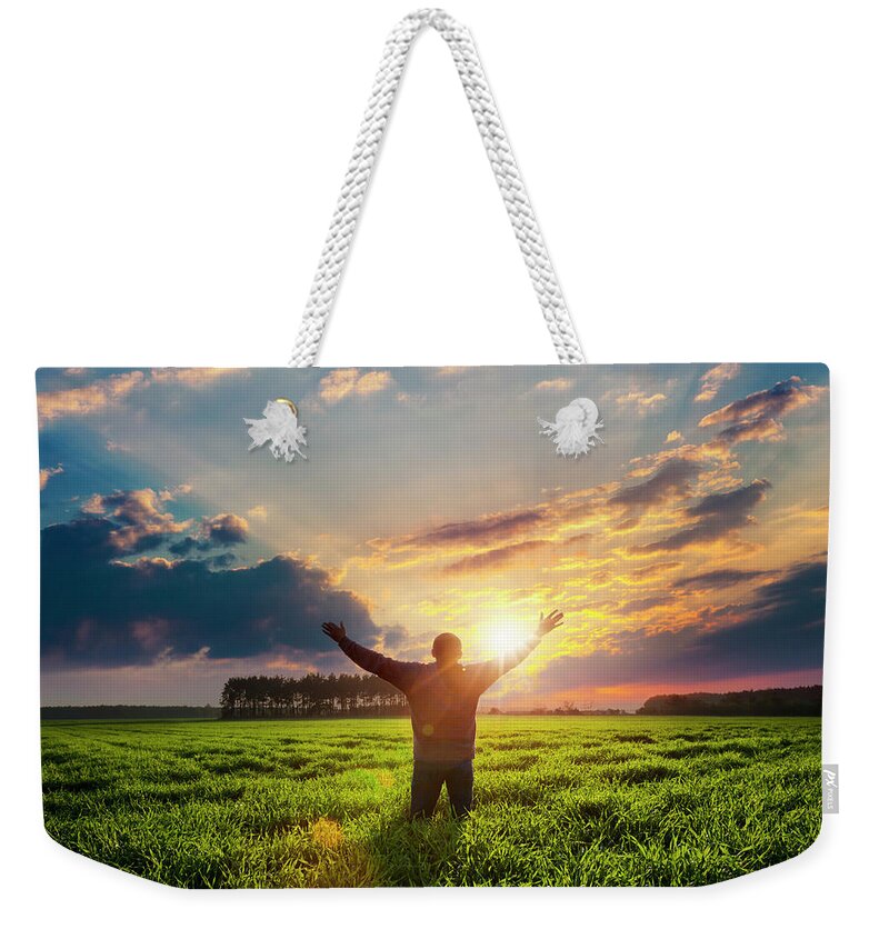 Human Arm Weekender Tote Bag featuring the photograph Free Man With Raised Hands by Avalon studio
