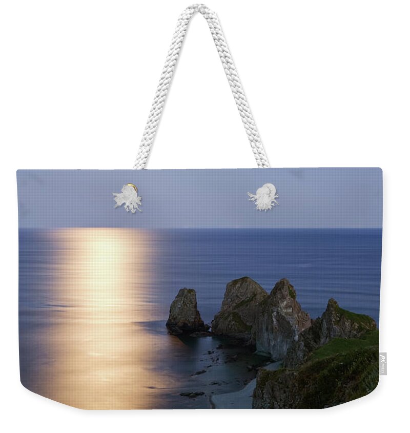 Scenics Weekender Tote Bag featuring the photograph Full Moon On Cape Four Rocks by V. Serebryanskiy