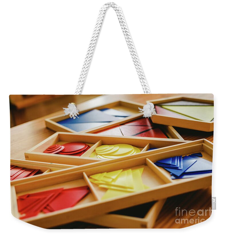 Arithmetic Weekender Tote Bag featuring the photograph Geometric material in Montessori classroom for the learning of children in mathematics area. by Joaquin Corbalan