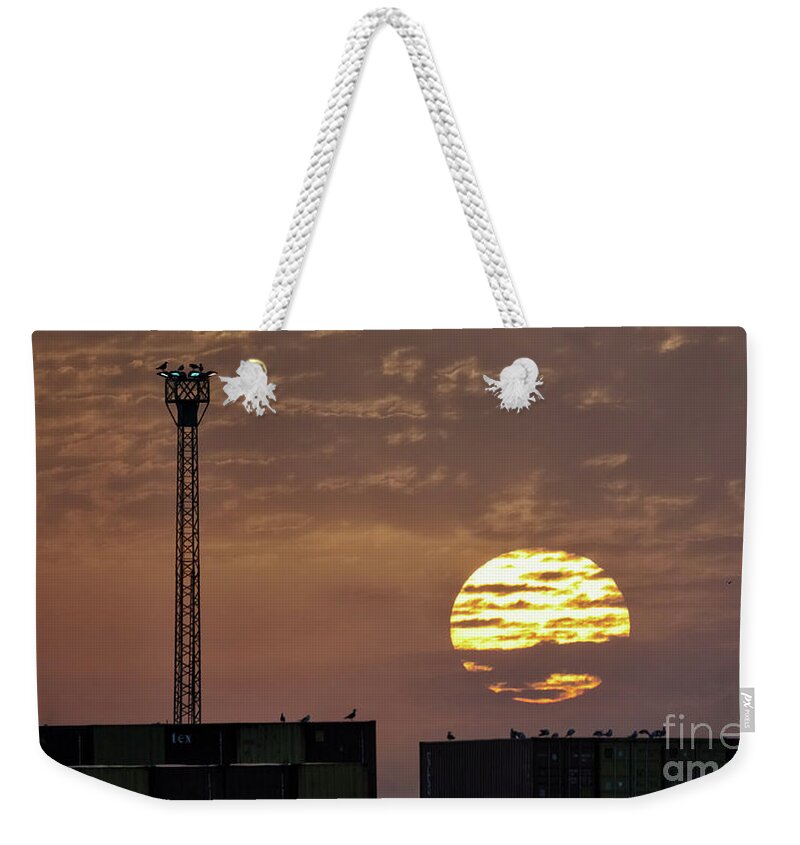 Bright Weekender Tote Bag featuring the photograph Giant Sun at Sunrise Cadiz Harbour by Pablo Avanzini
