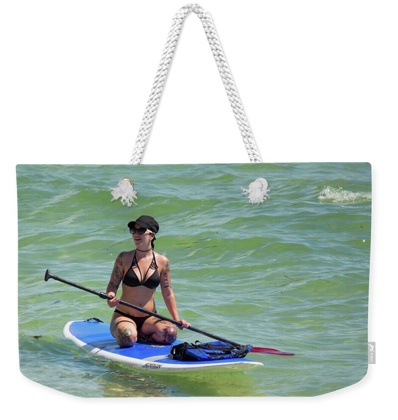 Female Weekender Tote Bag featuring the photograph Girl On A Paddleboard by John Black