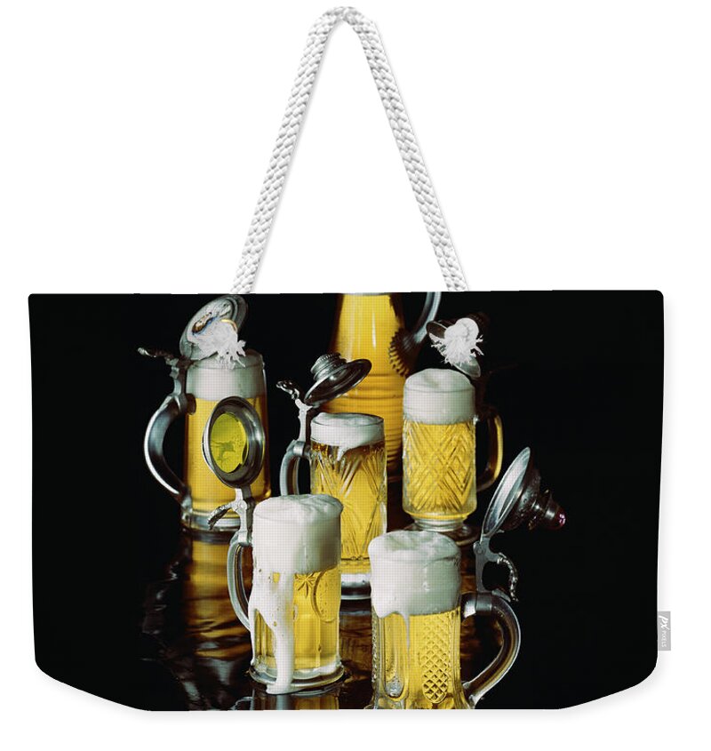 Food And Drink Weekender Tote Bag featuring the photograph Glasses Of Beer With Froth, Close-up by Tom Kelley Archive