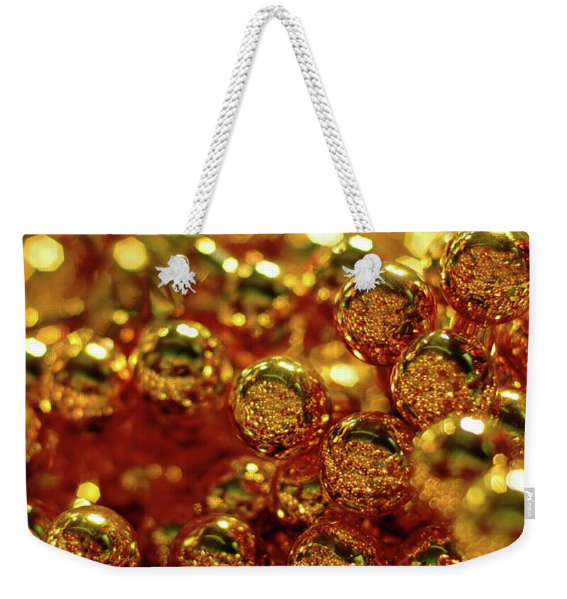 Holiday Weekender Tote Bag featuring the photograph Gold Christmas Balls by Naphtalina
