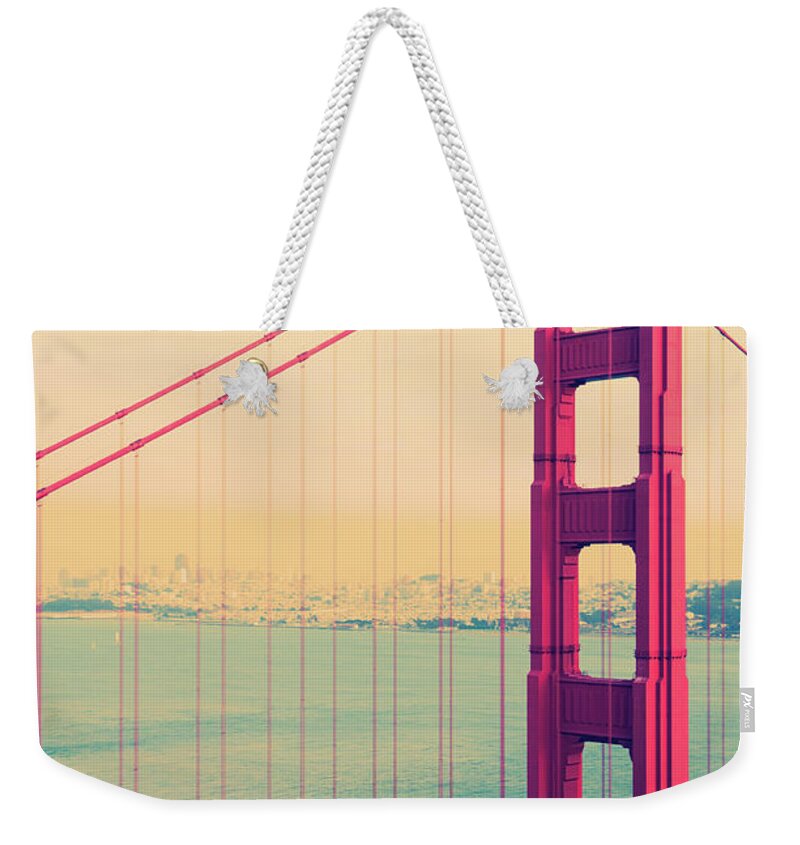 1950-1959 Weekender Tote Bag featuring the photograph Golden Gate Bridge Spanning San by Gregobagel