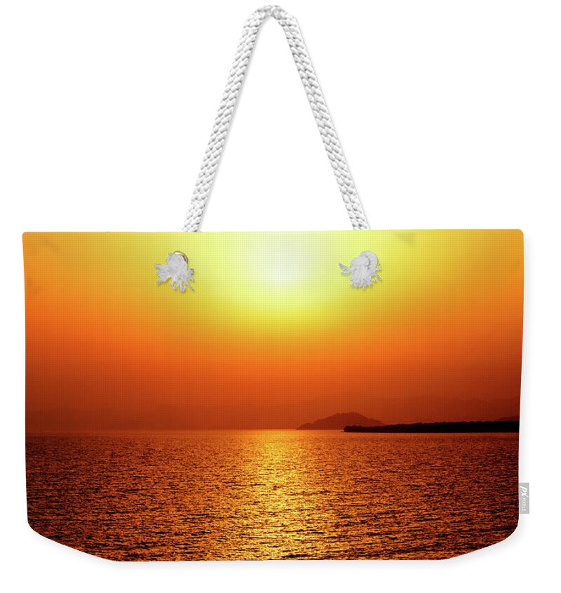 Sunset Weekender Tote Bag featuring the photograph Golden sunset by Sun Travels