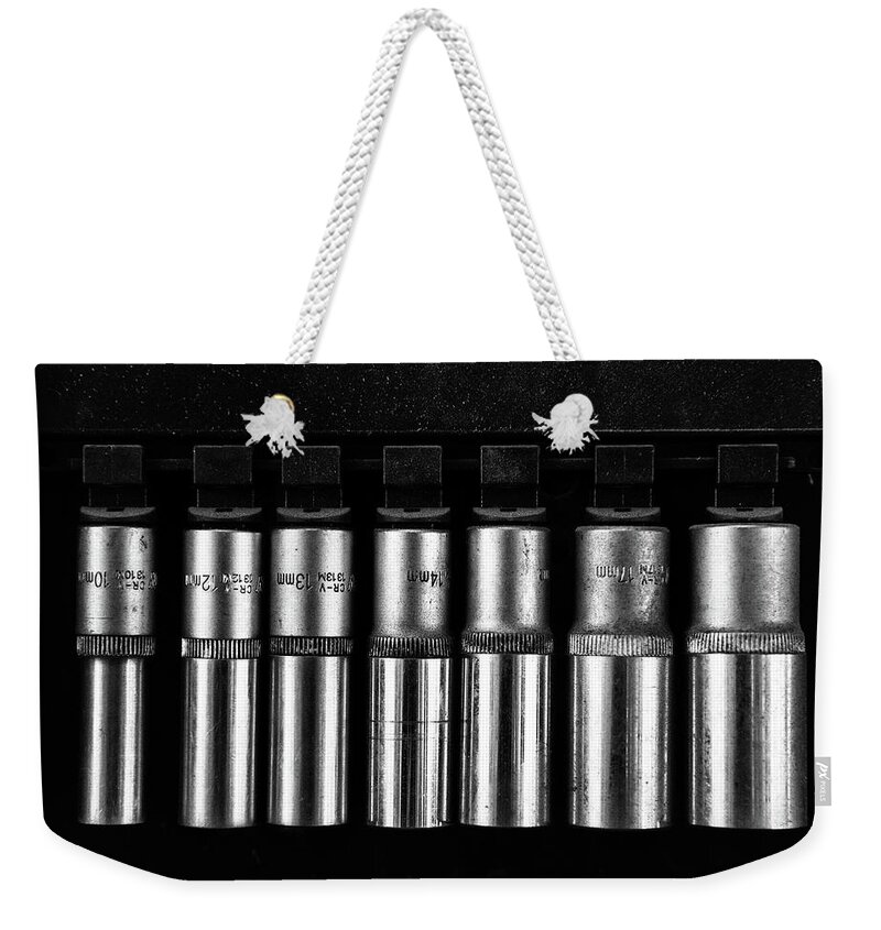 Tools Weekender Tote Bag featuring the photograph Group of metal Spanner heads of various sizes by Michalakis Ppalis