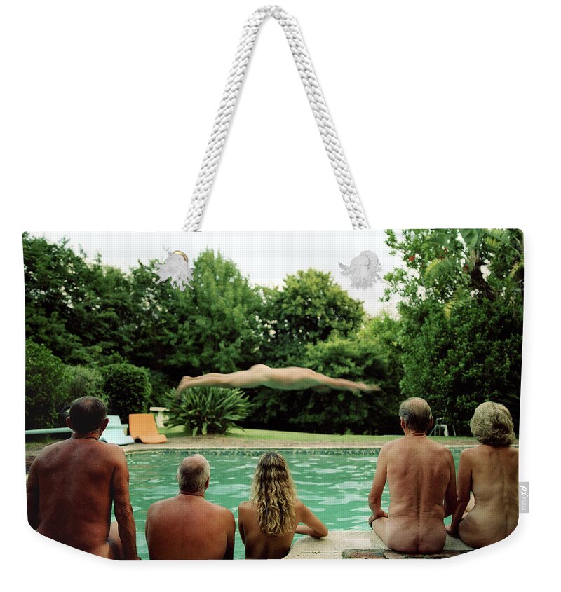 Diving Into Water Weekender Tote Bag featuring the photograph Group Of Naturists Watching Man Dive by Tim Macpherson