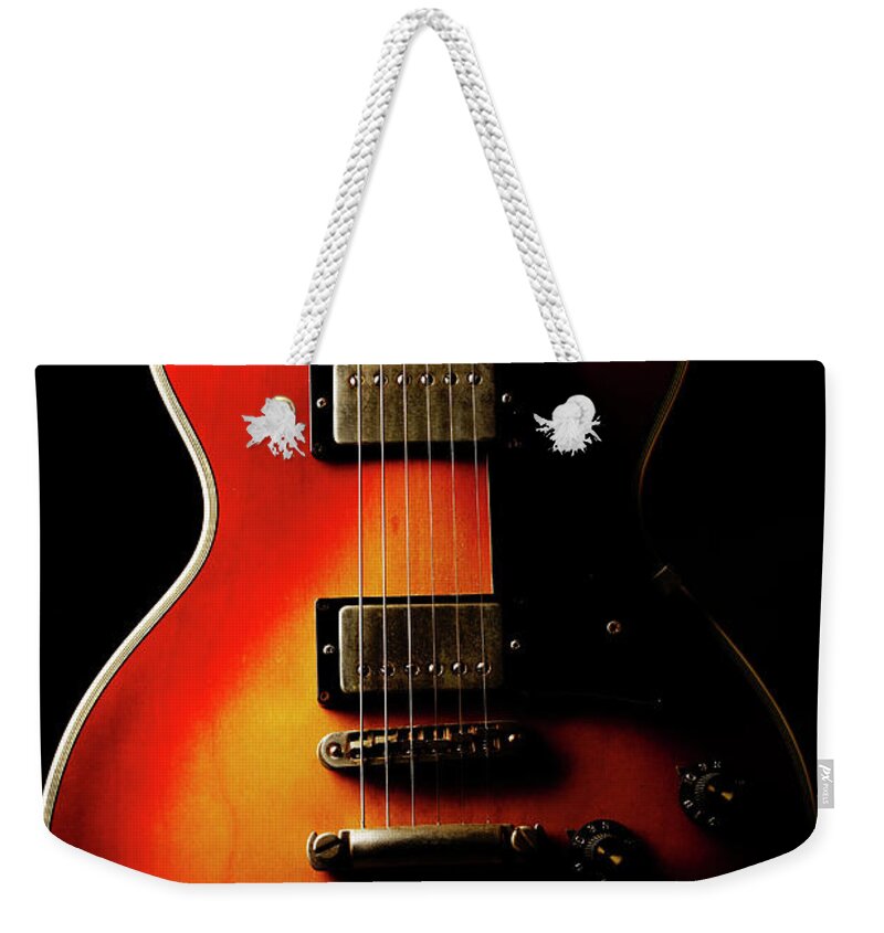 Music Weekender Tote Bag featuring the photograph Guitar Instruments Product Shot by Kazuhiro Tanda