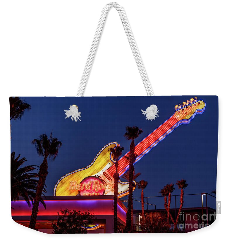 Las Vegas Strip Weekender Tote Bag featuring the photograph Hard Rock Casino Con Air Guitar at Dusk From West by Aloha Art