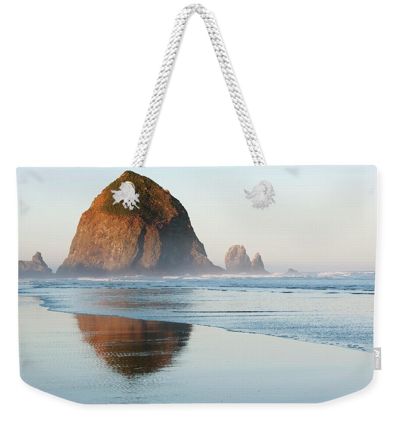 Scenics Weekender Tote Bag featuring the photograph Haystack Rock In The Morning, Cannon by Shanna Baker