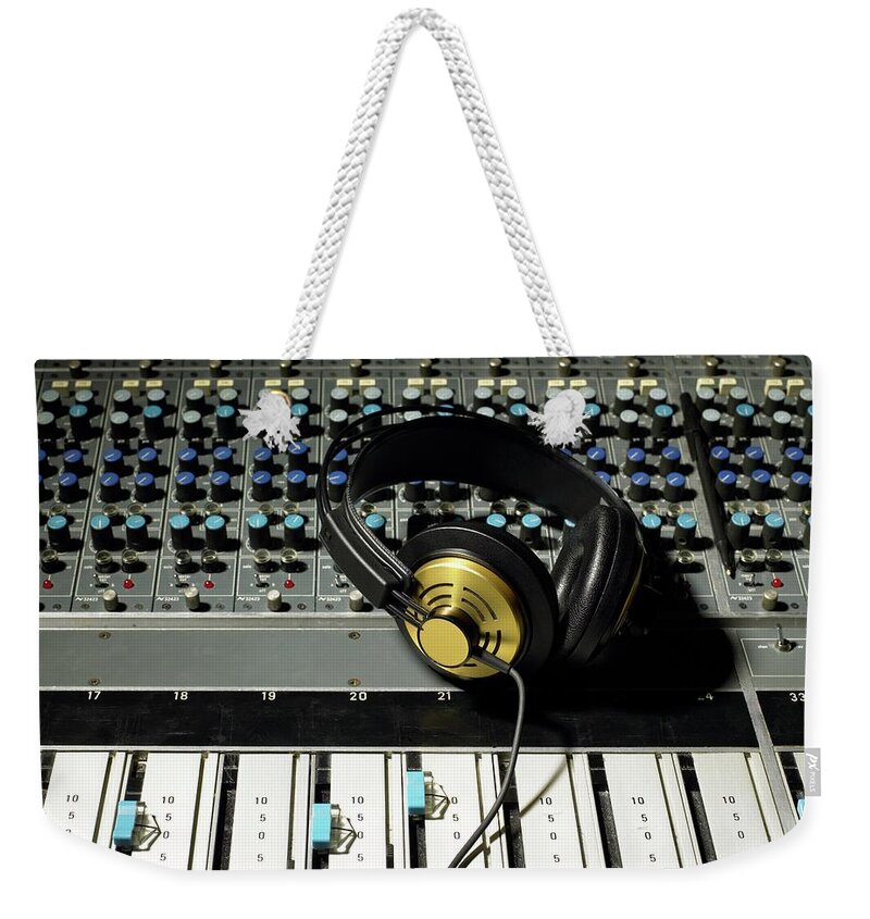 Keypad Weekender Tote Bag featuring the photograph Headphones On A Mixing Desk by Image Source