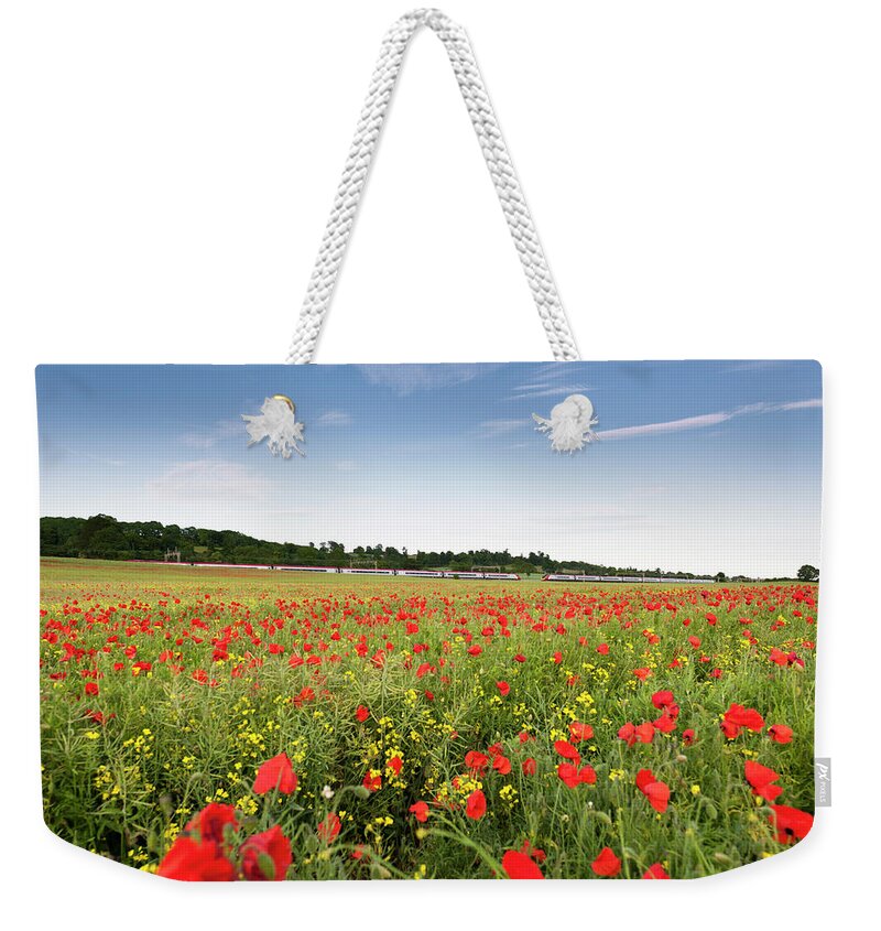 Train Weekender Tote Bag featuring the photograph High Speed Train Travelling Through by Owenprice