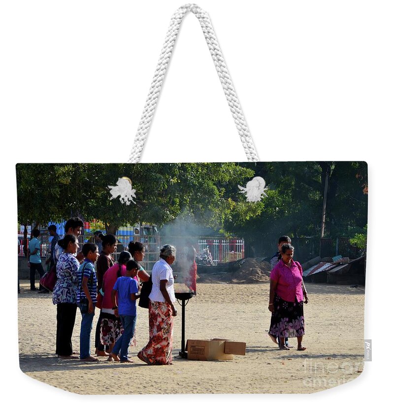 Hindu Weekender Tote Bag featuring the photograph Hindu Tamil worshippers make offerings at compound of Nallur Kandaswamy temple Jaffna Sri Lanka by Imran Ahmed