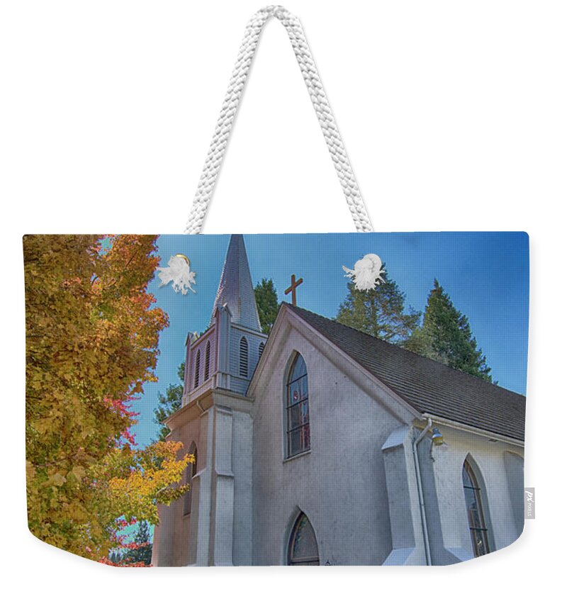 Saint Canice Weekender Tote Bag featuring the photograph His Light Shines Straight by Tom Kelly
