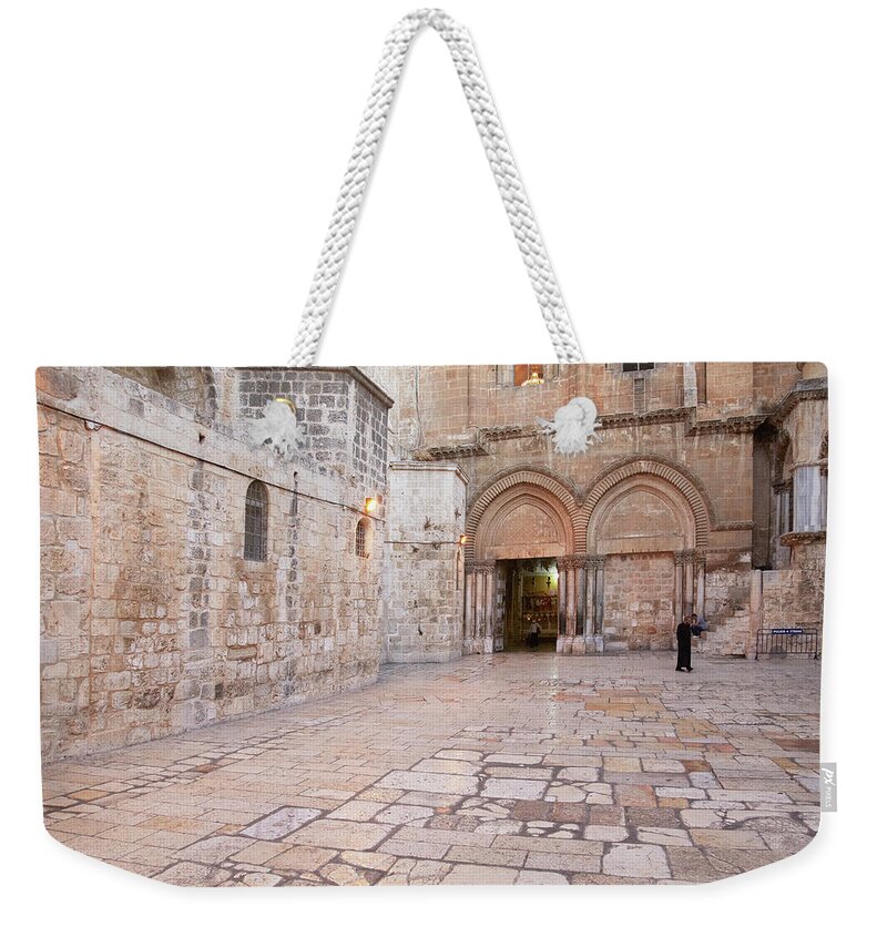 Stone Wall Weekender Tote Bag featuring the photograph Holy Sepulcher In Jerusalem by Chris Tobin
