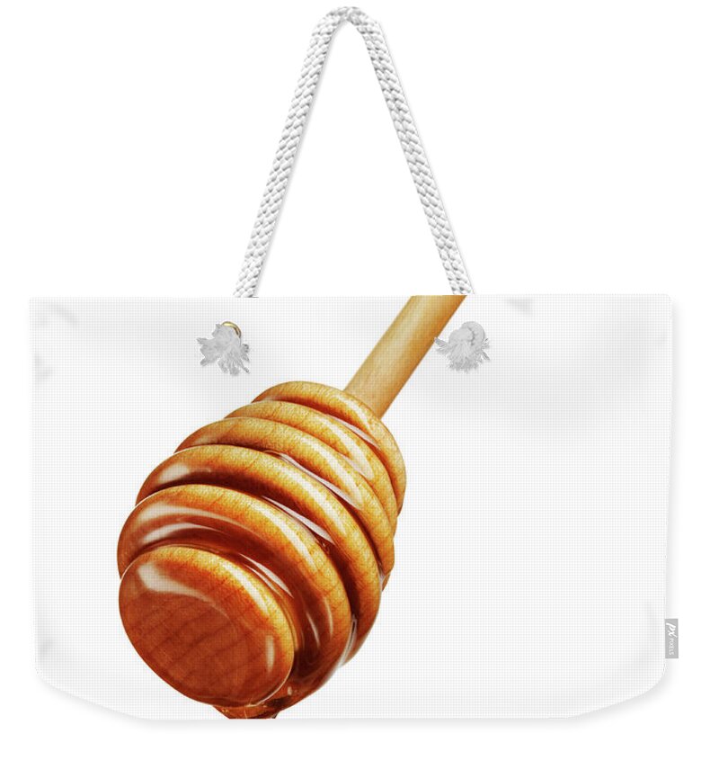 White Background Weekender Tote Bag featuring the photograph Honey Dripping Off Dripper by Lauren Burke