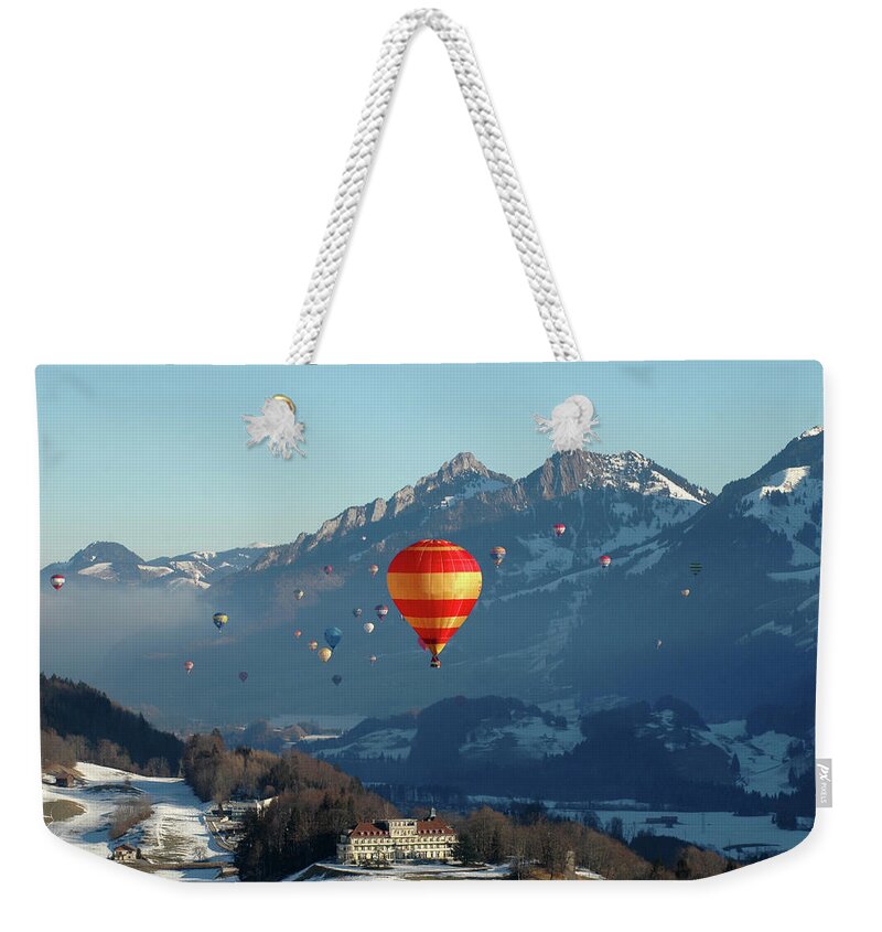 Scenics Weekender Tote Bag featuring the photograph Hot Air Balloons Swiss Alps by Stevenallan