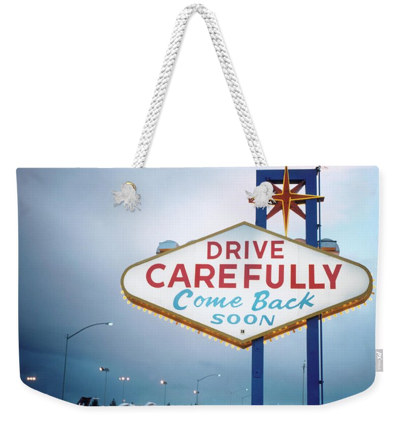 Time Of Day Weekender Tote Bag featuring the photograph Illuminated Road Sign by Silvia Otte