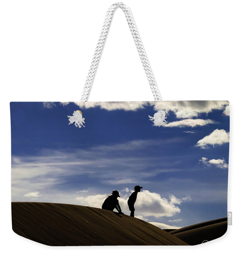 Blue Sky Weekender Tote Bag featuring the photograph In The Distance by Dennis Dempsie