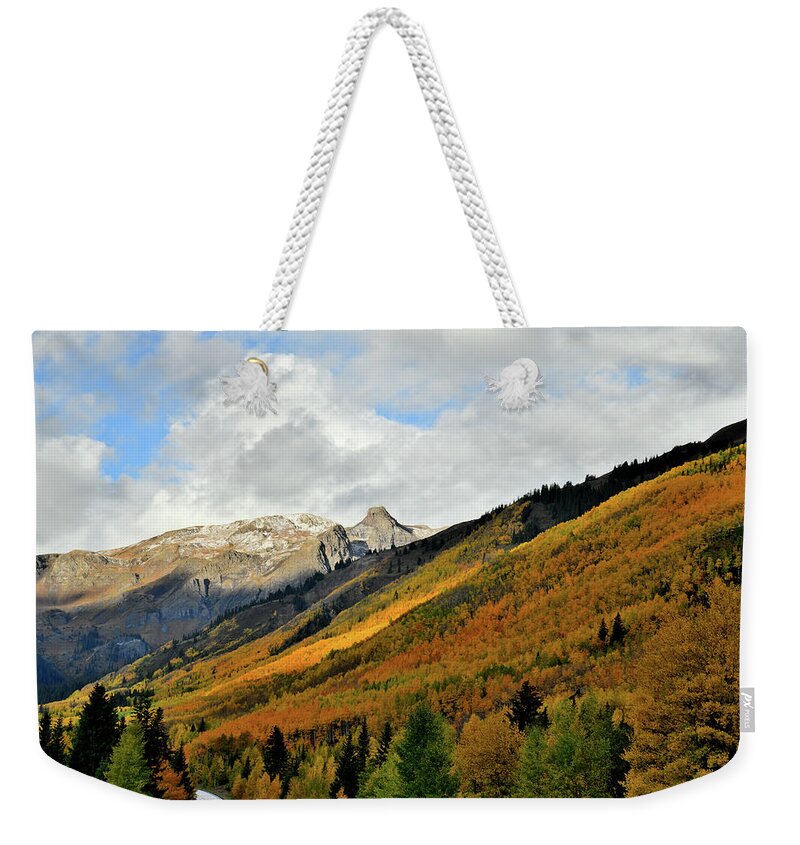 Red Mountain Pass Weekender Tote Bag featuring the photograph Intermittent Light on Fall Colors in Colorado by Ray Mathis