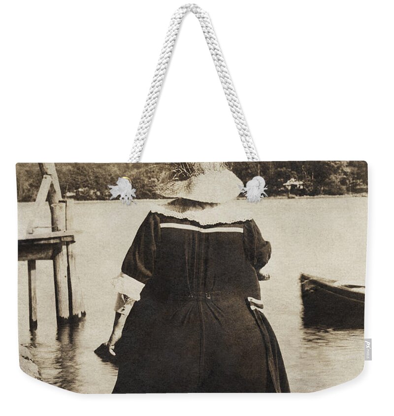 It Weekender Tote Bag featuring the photograph It Floats - version 2 by Mark Miller