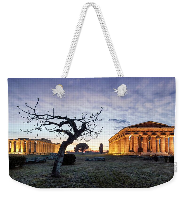 Estock Weekender Tote Bag featuring the digital art Italy, Campania, Salerno District, Cilento, Paestum, The Hera ( Paestum Basilica) And Neptune Temples. Time Lapse by Guido Baviera