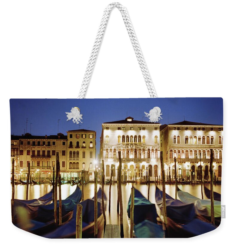 Wooden Post Weekender Tote Bag featuring the photograph Italy, Veneto, Venice, Row Of Gondolas by Gary Yeowell
