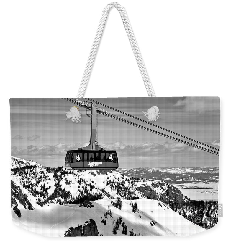 Jackson Hole Tram Weekender Tote Bag featuring the photograph Jackson Hole Aerial Tram Over The Snow Caps Black And White by Adam Jewell