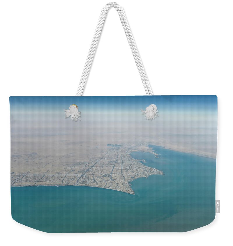 Looking Weekender Tote Bag featuring the photograph Kuwait City Seen From The Sky by Ajansen
