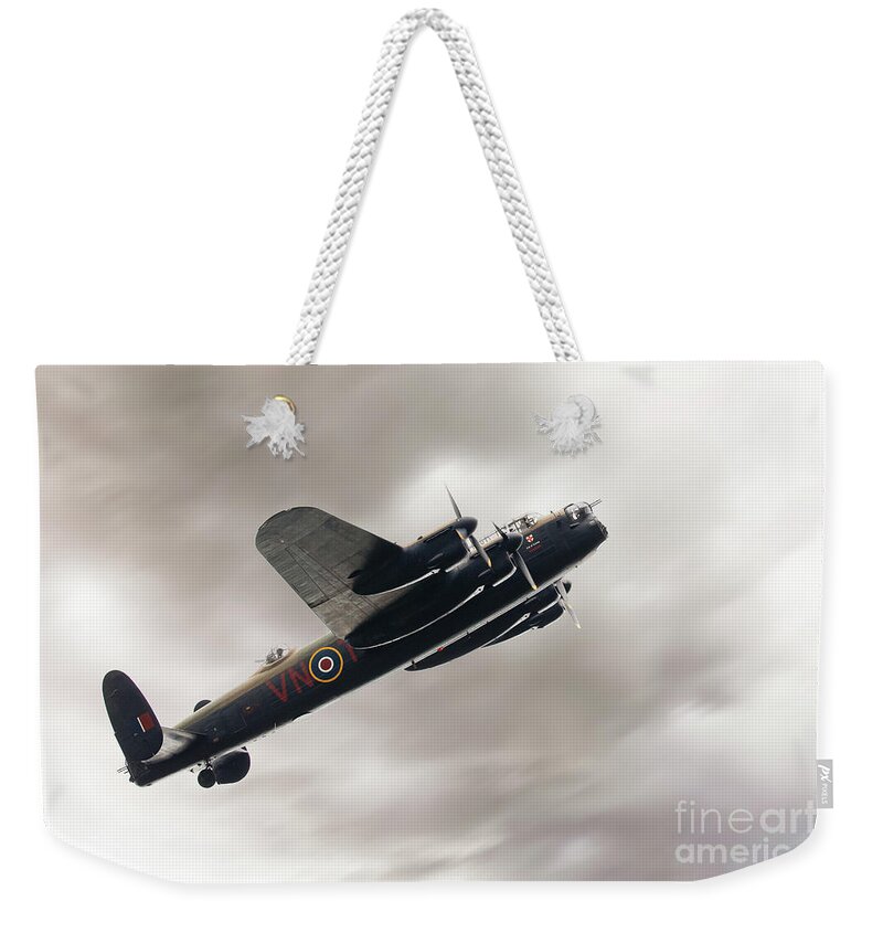 Aviation Weekender Tote Bag featuring the photograph Lancaster bomber close up fly past by Simon Bratt