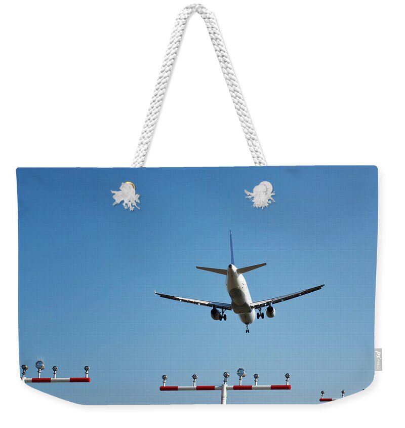 Engine Weekender Tote Bag featuring the photograph Landing Airplane by Ollo