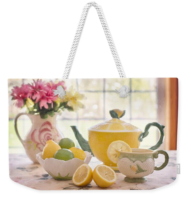 Cute Weekender Tote Bag featuring the photograph Lemon tea by Top Wallpapers